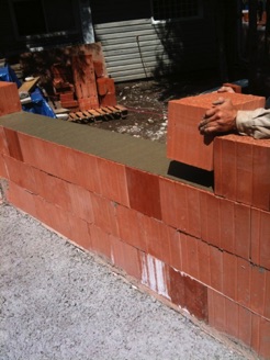 Laying the first courses of Coriso clay blocks