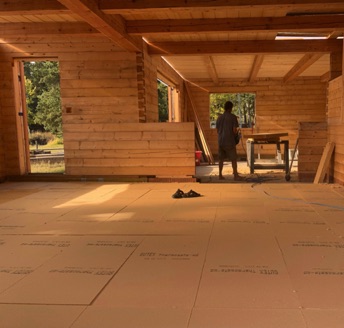 Gutex wood fibre floor insulation being laid
