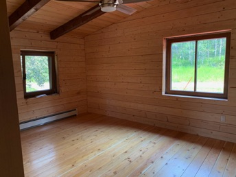 Guest bedroom with finished Douglas fir flooring
